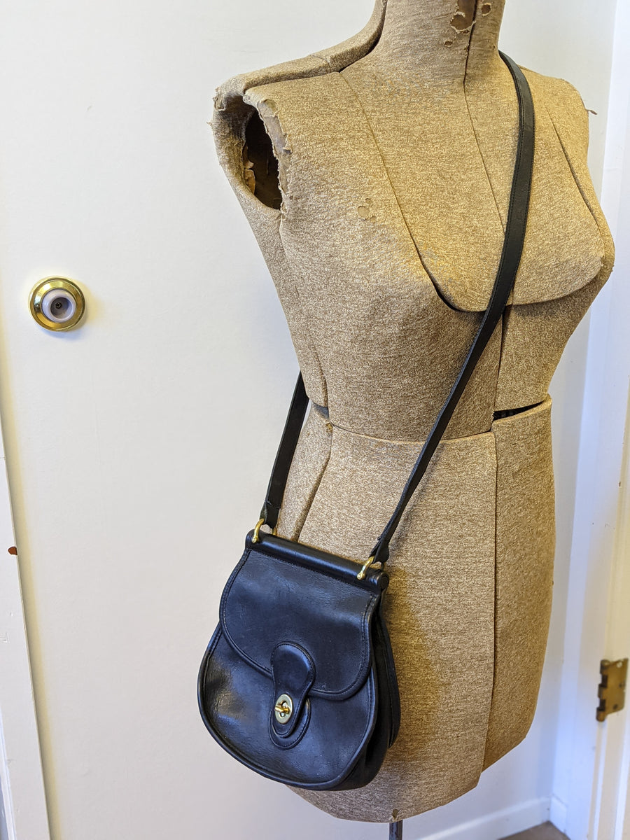 black leather vintage coach purse with adjustable crossbody strap