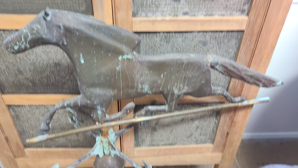 Old copper horse weathervane