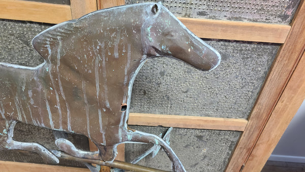 Old copper horse weathervane