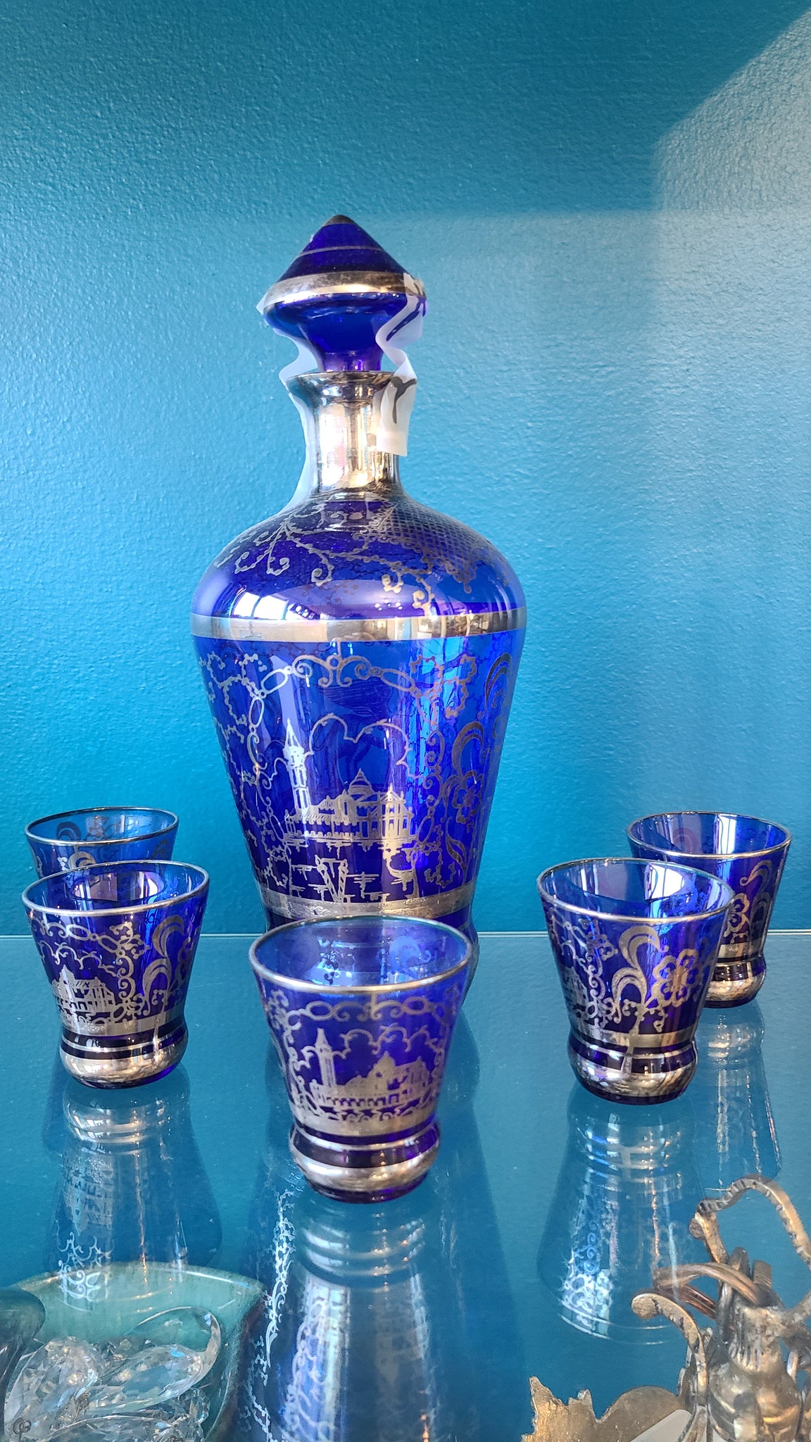 Cobalt blue glass liquor decanter with glasses with silver inlay